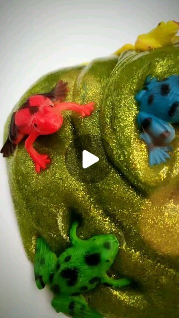 Jen Buchheit on Instagram: "Tree Frog Slime! 🐸

Slime is one of Rosie's favorite sensory activities, and it's easy to make! For this rainforest slime I used blue, green, and gold glitter glue. For each 6oz bottle of glue, I added:

1 teaspoon baking soda
1&1/2 tablespoon contact solution
1 tablespoon water

Rosie was singing "Five Green and Speckled Frogs" as she played and having the frogs jump into a bowl of water. I have a feeling we'll be playing with this slime all week! 😊

#ourmessylittlehands ✔️ Jungle
#thingstodowith_jungle 
#makecreateplay ✔️ Nature
#getcreativewith ✔️ Nature
#inspired_creative_kids ✔️ Sensory
#ministhatplay ✔️ Sensory Play
#abcsensoryplay ✔️ Nature
#sensoryinseptember ✔️ Nature
#mudpies_rainbowskies ✔️ Animals
#playathometoday ✔️ Sticky
#tfichallenge ✔️ Rainfor Contact Solution, Alien Crafts, Glitter Glue, Tree Frogs, Sensory Activities, Sensory Play, Feel Better, Baking Soda, Bowl