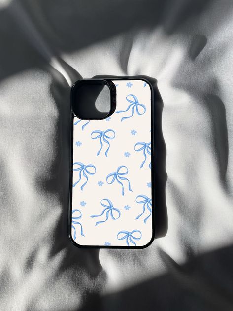 🎀💙 Elevate your phone style with our Blue Ribbon Print iPhone Case! 📱✨ Add a touch of timeless elegance to your device with this charming design featuring a delicate ribbon pattern in shades of blue. 💎🌟 Perfect for those who appreciate classic aesthetics and a touch of sophistication in their accessories. Whether you're heading to a special occasion or simply want to showcase your love for refined details, this case is the epitome of chic simplicity. 💙 Blue Case Aesthetic, Blue Ribbon Aesthetic, Ribbon Aesthetic, Phone Case Inspo, Coquette Phone Case, Ribbon Pattern, Print Iphone, Blue Cases, Iphone Prints