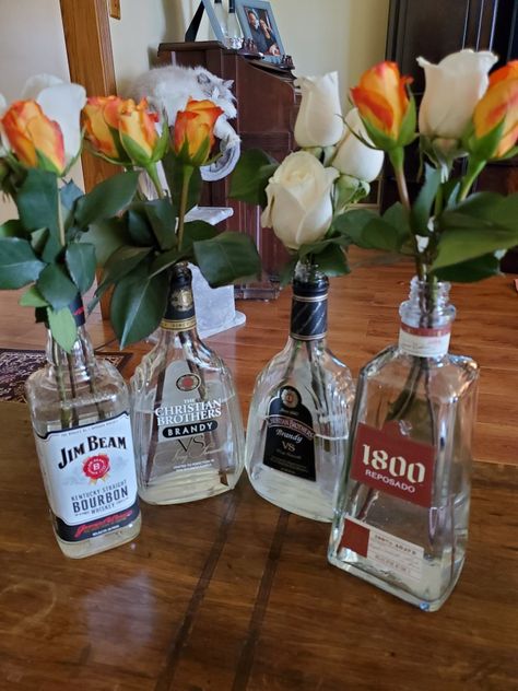 Liquor Bottle Vase, Alcohol Centerpieces Parties, Alcohol Bottle Vase, Alcohol Themed Party Decorations, Empty Alcohol Bottle Crafts, Alcohol Themed Party, Empty Liquor Bottle Ideas, Alcohol Table, Liqour Bottles