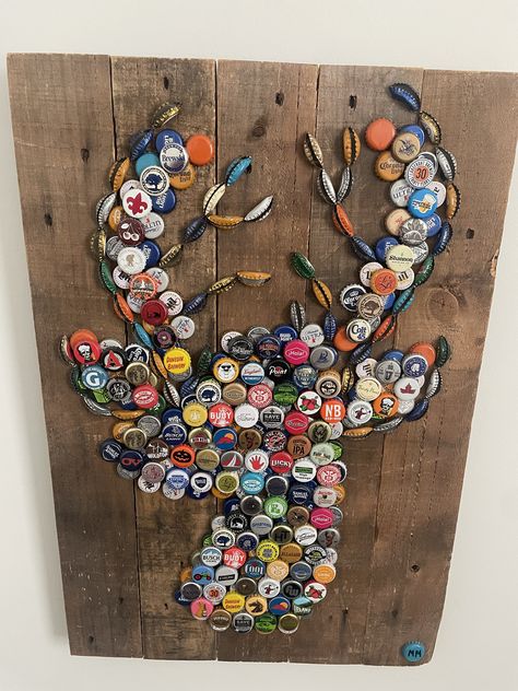 "This piece is produced from reclaimed wood and bottle caps, would make a great addition and gift to any hunter or outdoorsman. this piece is approximately 28\" x 18\"." Beer Bottle Art Creative, Bottle Cap Animals, Beer Bottle Cap Ideas, Dyi Bottle Cap Art, Deer Bottle Cap Art, Diy Beer Bottle Cap Crafts Man Cave, Beer Cap Projects, Funny Photoshoot, Bottle Cap Lures