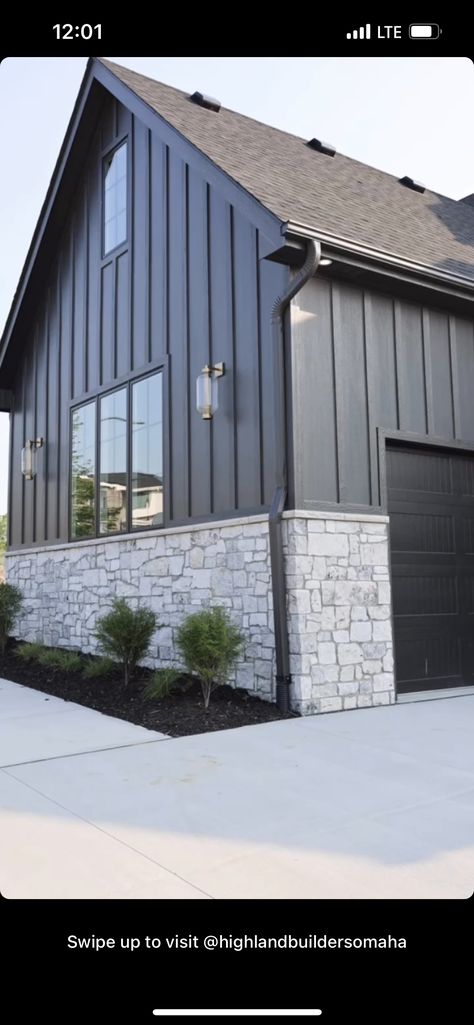 Charcoal Siding With Stone, Dark Grey Siding With Black Trim, Gray Vertical Siding Exterior, Iron Gray Hardie Siding, Gray And Black Stone House Exterior, Charcoal Grey Barndominium Exterior, Dark Modern Farmhouse Exterior, Diamond Kote Graphite Siding, Dark Grey Siding