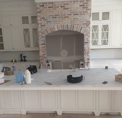 To die for brick fireplace Farmhouse Coastal Kitchen, Farmhouse Coastal Decor, Brick Farmhouse, Brick Archway, Oven Hood, Farmhouse Living Room Furniture, Farmhouse Coastal, Instagram Kitchen, Diy Living Room Decor