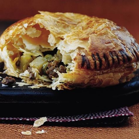 These beef pies make an immensely satisfying meal or snack on the go. The ready-to-use puff pastry bakes up golden and flakythe perfect accompaniment to the rich, meaty filling. Curry Pie Recipe, Curry Pies, Curry Pie, Curried Beef, Beef Pie Recipe, Baking Savory, Curry Beef, Beef Pie, Savoury Pies