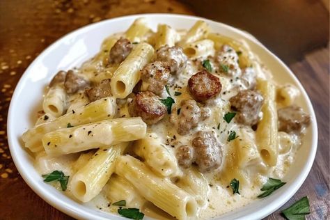 Indulge in the ultimate comfort food with this rich and creamy rigatoni dish, featuring savory beef sausage and a luscious Alfredo sauce that hugs every bite. Perfect for a cozy dinner or impressing your guests, this recipe is a guaranteed crowd-pleaser. Hungry? Click for the full recipe #CreamyPasta #BeefSausage #RigatoniRecipe #AlfredoPasta #EasyDinnerIdeas #PastaLovers #DinnerInspiration #ComfortFood #QuickMeals #HomemadePasta #SausagePasta #DeliciousDinners Homemade Rigatoni Pasta, Homemade Rigatoni, Alfredo Rigatoni, Cheesy Alfredo Sauce, Creamy Rigatoni, Alfredo With Sausage, Rigatoni Pasta Recipes, Rigatoni With Sausage, Sausage Alfredo Pasta