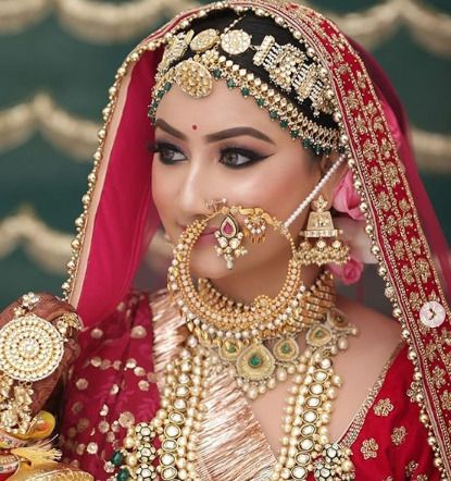 We are sure you would like this large bridal Nath. It may have caught your attention because of how well it complemented the old style. It goes well on broad faces and girls with double chin. Nath Designs, Nath Bridal, Bridal Nath, Marathi Bride, Blessed Wednesday, Sabyasachi Bride, Indian Bridal Photos, Contemporary Bride, Hindu Culture