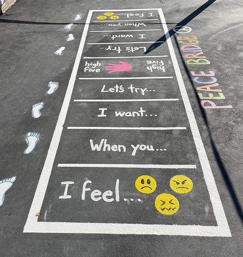 Peace Garden Ideas School, Recess Ideas School Outdoor, Playground School Ideas, Outdoor Sensory Walking Path In School, Elementary Playground Ideas, Affirmation Hopscotch, Around And Find Out, School Yard Design, School Corridor Decoration Ideas