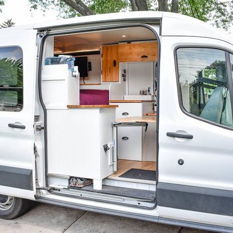 Living and storage ideas in a diy ford transit van conversion. Read this #vanlife blog for advice for how to build your own campervan conversion! Tricks for adding a bathroom, toilet, kitchen and cozy living area! Tips for how to find free camping and solar panel wiring and plumbing diagrams for living in a van full time! Ford Transit Rv, Transit Camper Conversion, Ford Transit Camper Conversion, Transit Conversion, Ford Transit Conversion, Ford Transit Campervan, Ducato Camper, Ford Transit Camper, Transit Van