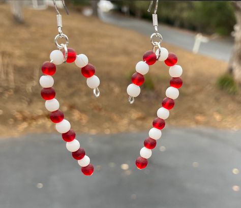 "These will be great for the Christmas holiday! Cute sea glass Christmas candy canes. Perfect little gift for someone or a stocking stuffer. Fantastic earrings for the holiday! These are 2\"  long. Earring hooks are .925 sterling silver. These will be wrapped in tissue paper, put in a box and mailed First Class in a bubble mailer. Please note: If you are outside of the US, shipping can take up to 3-6 weeks to get to you... maybe a little longer, especially during the holidays.  Be sure to check out all of my other designs and colors, using this link: https://www.etsy.com/shop/SmithNJewels?ref=seller-platform-mcnav§ion_id=27417665" Sea Glass Candy, Diy Christmas Earrings, Xmas Beads, Candy Cane Earrings, Sea Glass Christmas, Christmas Candy Canes, Beaded Jewelry Earrings, Cheap Christmas Gifts, Long Earring