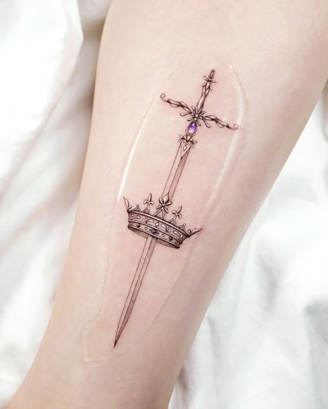 Delicate Sword and Crown Arm Tattoo Tatoo Crown, Kpop Tattoo, Crown Tattoos For Women, Crown Tattoo Design, Crown Tattoo, Tattoo Designs And Meanings, Simplistic Tattoos, Piercing Tattoo, Creative Tattoos