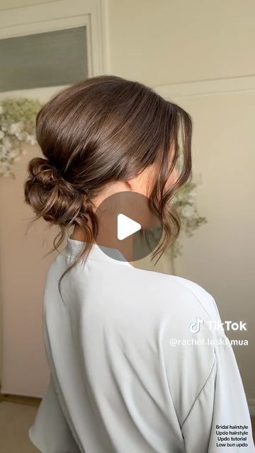 Kristina Youssef - K Y K ® on Instagram: "California stylist @rachel.luskhmua shares how to create a stunning textured clean bun using cult favourite @kykhaircare Magic dust volume powder.   Use the powder to add volume at the crown before back combing, and use it to add texture and fullness before pinching on the hair.  Add it from roots to ends to create the perfect texture in your fringe for facial framing." Hair Bun Low Tutorial, Easy Low Bun For Wedding Guest, Soft Loose Updo, Higher Updos, Evening Hair Updos, Low Bun For Shoulder Length Hair, Low Bun Covering Ears, Low Bridesmaid Bun, Loose Low Bun Wedding Hair Front View