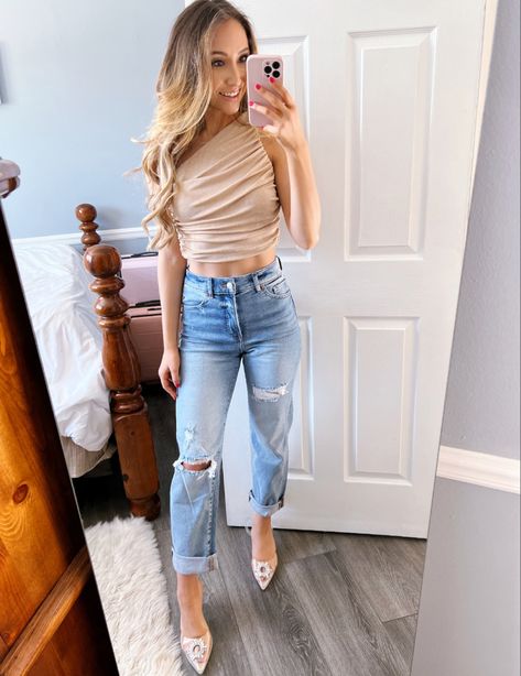 She is wearing this top that is perfect for going out, its from Amazon paired with some ripped jeans from Express and some sparkly heels from Amazon