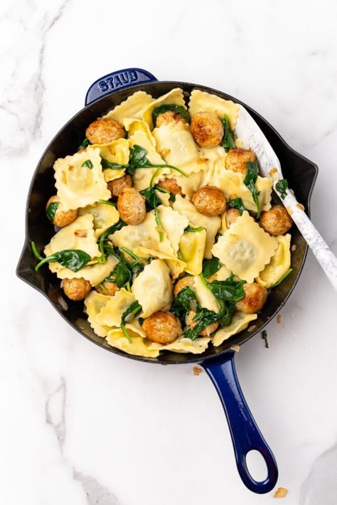 Blue staub skillet with ravioli, meatballs and spinach. Ravioli Recipe, Ravioli And Meatballs, One Skillet, Easy Ravioli, Meatballs Dinner, Spinach Meatballs, Spinach Ravioli, Meatball Dinner, Main Dish Casseroles