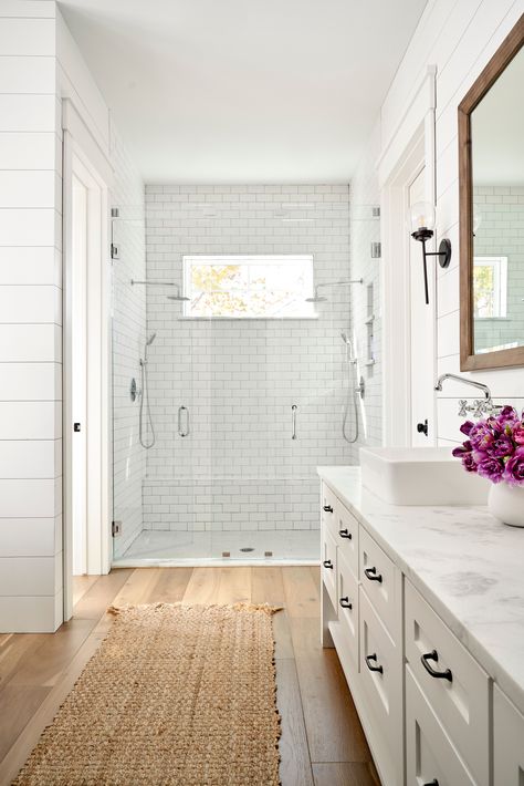 The Most Popular Flooring Trends of 2023 Bathroom White Cabinets Wood Floor, Wood Floors In Bathroom Master Bath, Wood Floors Master Bath, White Vanity Wood Floor Bathroom, Light Wood Flooring Bathroom, Small Bathroom With Tile Floor, Shower Remodel Wood Floor, Bathroom Inspiration Wood Floor, Lvp Floors In Bathroom