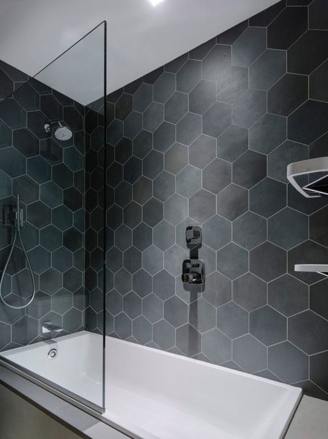 Bathroom Tile Ideas - Grey Hexagon Tiles // Hexagon tiles in various shades of grey line the walls in the 2-in-1 bath and shower in this bathroom. Gray Hexagon Tile, Tiles Hexagon, Hexagon Tile Bathroom, Gray Shower Tile, Hexagonal Tiles, Bathroom Tile Inspiration, Grey Bathroom Tiles, Hexagon Tile, Bathroom Tile Designs