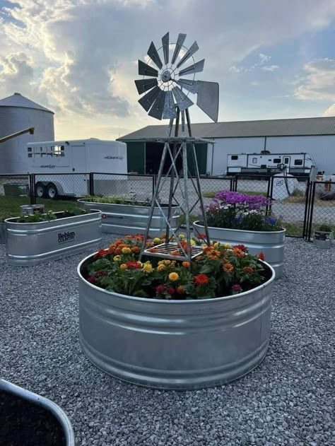 Windmill Flower Bed, Dream Front Yard, Large Yard Decor, Flower Bed In Front Of Mobile Home, Diy Windmill Outdoor, Farmhouse Outdoor Decor Ideas, Windmill Yard Decor Outdoor, Western Garden Ideas, Well Cover Ideas Outdoor Diy