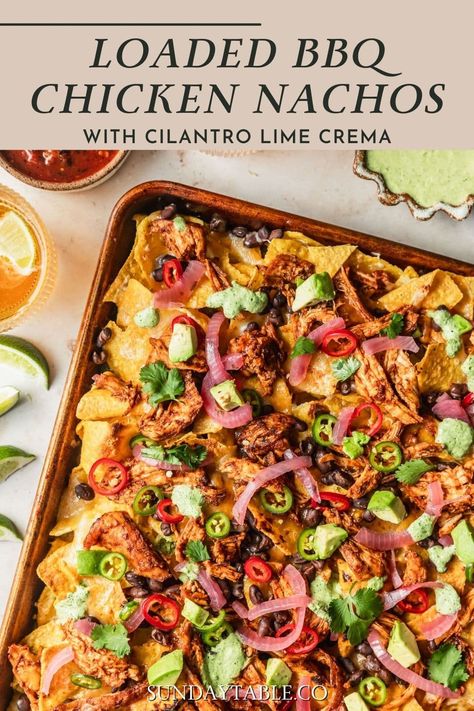 I love making these BBQ chicken nachos with cilantro-lime crema for parties and get-togethers! They go great with beer and they're amazing for a crowd. These nachos are loaded with tangy BBQ chicken, melty cheese, beans, jalapeños, avocado, and cilantro-lime crema. They're easy to make in the oven on a sheet pan or even in an air fryer. You can even make the shredded chicken in a crockpot! For a vegetarian version, try BBQ beans instead. No matter how you make them, they're the best nachos ... Loaded Bbq Chicken Nachos, Nachos Recipe Chicken, Barbecue Chicken Nachos, Loaded Chicken Nachos Recipe, Loaded Chicken Nachos, Chicken In A Crockpot, The Best Nachos, Cilantro Lime Crema, Best Nachos