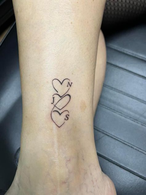 Tattoo Ideas Female Siblings, Hearts And Initials Tattoos, 3 Hearts With Initials Tattoo, Small Grandchildren Tattoo Ideas, Hearts With Names Tattoos, 5 Heart Tattoo, 3 Heart Tattoo Designs, Heart Tattoo With Letter, Linked Hearts Tattoo