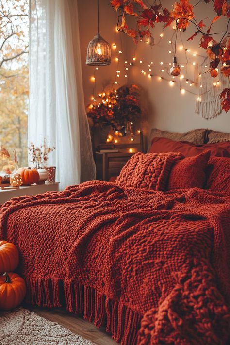 Autumn-inspired bedroom with a red throw blanket and soft, warm lighting. Fall Bedding Bedrooms, Cozy Autumn Bedroom, Fall Aesthetic Bedroom, Bedroom Decor Ideas Cozy, Fall Patio Decor, Autumn Bedroom, Fall Patio, Cozy Bedding Ideas, Fall Bedroom Decor