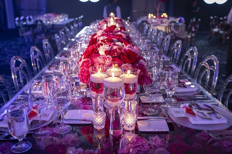 This rose filled glass table was created to make an infinity affect from the red and pink rose centerpieces. The acrylic logo put the finishing touch on the place settings for this rose themed Bat Mitzvah at St Regis Bal Harbour.  Bar Mitzvah Themes, Bar Mitzvah Party, Customized Party, Rose Mitzvah, Flower Bouquet, Customized Party, Pink and Gold Explosion, Customized Tables, Flower Tables, Pink Glam, Rose Glam, Flower Centerpieces, Romantic Candles Pink Rose Centerpieces, Red Rose Centerpieces, Flower Tables, Red Roses Centerpieces, Bar Mitzvah Themes, Acrylic Logo, Mitzvah Themes, Bar Mitzvah Party, Rose Centerpieces