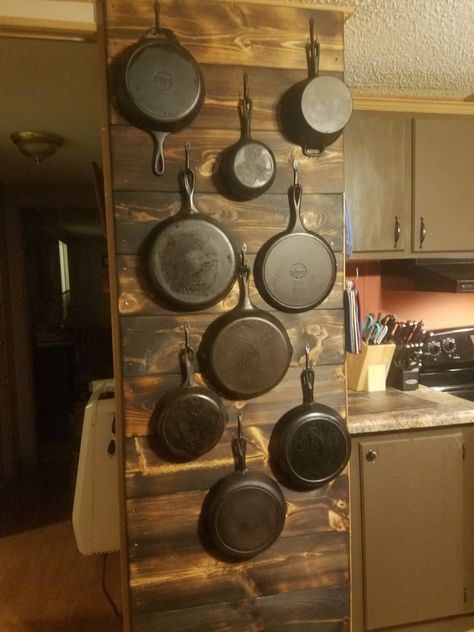 My husband made this wall for me to hang my cast irons on 😍 Hang Cast Iron Pans On Wall, Cast Iron Skillet Wall Hanger, Hanging Cast Iron Pans The Wall, Cast Iron Wall, Cast Iron Skillet Storage Ideas, Cast Iron Wall Display, Wood Wall Covering, Cast Iron Decor, Iron Storage