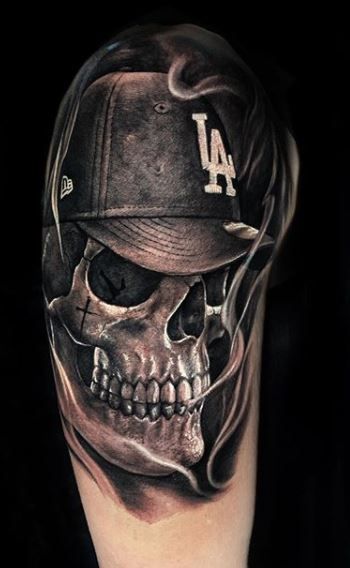 Skull With Baseball Cap Tattoo, Skull Tattoos For Men Shoulder, Skull With Hat Tattoo, Skull Tattoos Unique, Gangsta Skull Tattoo, Men’s Skull Tattoos, Men Skull Tattoos, Skull Sleeve Tattoos For Guys, Skull With Crown Tattoo