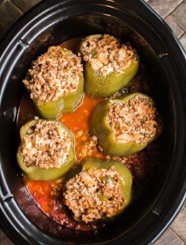 I love stuffed peppers so much! I have memories of my mother making them in the summer and whenever I make them, it brings back wonderful memories. Making them in the crockpot is my favorite way of cooking them. Rice And Ground Beef, Classic Stuffed Peppers Recipe, Rice Stuffed Peppers, Stuffed Peppers Beef, Magical Slow Cooker, Stuffed Peppers With Rice, Crockpot Stuffed Peppers, Slow Cooker Stuffed Peppers, The Magical Slow Cooker