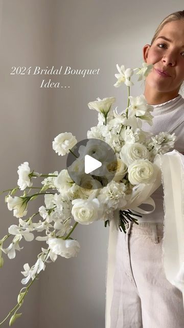 Morgan Cullimore┋ Florist on Instagram: "✨2024 Bridal Bouquet Inspo ✨ The classic, all white bouquet … with a slight cascade ;)   What do we think?!? 🤩 anyone doing white for their wedding this year?!" Free Form White Bouquet, Cascade Wedding Bouquet White, Modern Cascading Bouquet, February Bridal Bouquet, Abstract Bridal Bouquet, White Wedding Bouquets Elegant, All White Bouquet Wedding, Wedding Bouquets Cascade, Modern Bouquet Wedding