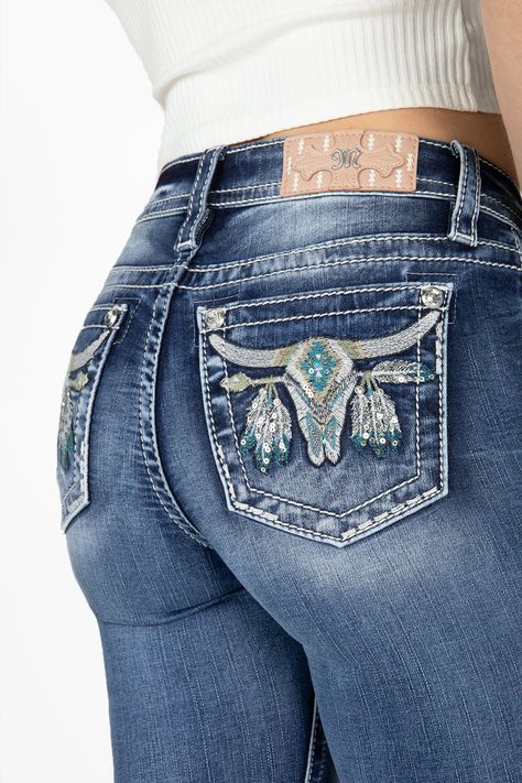 -Mid-rise, medium wash bootcut denim-Embroidered longhorn with Aztec print on back pockets-White, beige and turquoise stitching-Silver sequins and turquoise bead rivet-Rhinestone rivets-Light Pink brand patch with white Aztec embroidery-Fading-Front Rise: 9", Back Rise: 14"-Inseam: 34"-73% Cotton, 24% Viscose, 3% Elastane-Gentle machine wash with like colors in cold water, Tumble dry low Model is wearing size: 25Model Measurements: Height: 5'9" Bust: 34" Waist: 24" Hips: 34" Style No. M9187B-M89 Pure Western Jeans, Cow Girl Jeans, Embroidered Bootcut Jeans, Gem Jeans, Longhorn Design, Cowgirl Pants, Jean Embroidery, Cute Western Outfits, Country Jeans