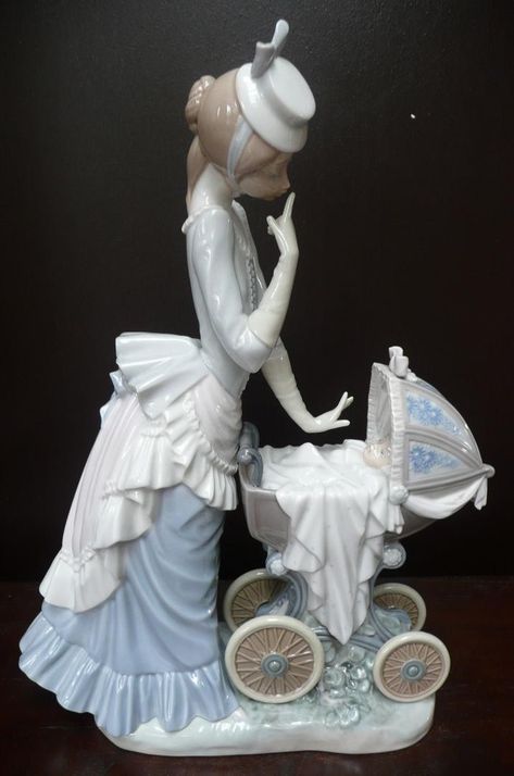 To offer: A beautiful figurine of a mother with her baby, made by Lladro / Spain. The figurine is named  Baby's Outing  or in Spanish  El Paseo de Bebe . It is number 01004938 and is 33 cm high and 2 Gifts For New Mothers, Lladro Porcelain, Lladro Figurines, Antique Artwork, Glass Ceramic, Fine Porcelain, Royal Doulton, Porcelain Figurines, Porcelain Dolls