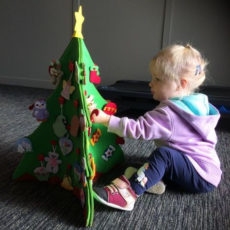 Cassie 16 months old enjoying the do it yourself felt Christmas tree Embroidery Christmas Tree, Toddler Christmas Tree, Trees For Kids, Diy Felt Christmas Tree, Christmas Trees For Kids, Rustic Christmas Ornaments, Felt Tree, Felt Christmas Decorations, Embroidery Diy