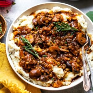 Lentil and Mushroom Stew over Potato-Parsnip Mash - Dishing Out Health Lentil Mushroom Stew, Parsnip Mash, Lentil Mushroom, Dishing Out Health, Mashed Parsnips, Vegetarian Stew, Mushroom Stew, Making Mashed Potatoes, Mashed Potato Recipes