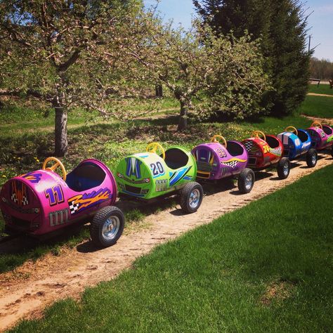 Our Barrel Train has a brand new look! Barrel Train, Barrel Projects, Kids Outdoor Play, Play Yard, Backyard Playground, Backyard For Kids, Kids Ride On, Play House, Pop Of Color