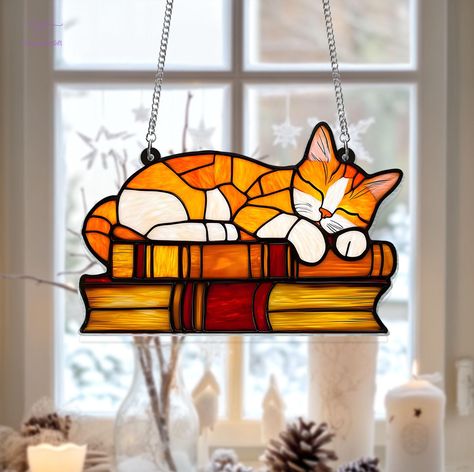 This stunning acrylic window hanging is perfect for adding a festive touch to your home. Whether you're looking for a unique ornament to hang in your window or a thoughtful gift for a loved one, this hanging decor is sure to impress. Made with high-quality materials, it captures the light beautifully, creating a warm and inviting atmosphere. 🎄 Order now and bring some seasonal cheer into your home! 🎁 - Best Material: The acrylic one is made from acrylic, nontoxic, odor-free, exquisite craftsma Cat Mom Gifts, Gifts For Librarians, Unique Ornament, Stained Glass Patterns, Orange Cat, Window Hanging, Cat Mom, Book Lovers Gifts, Window Decor