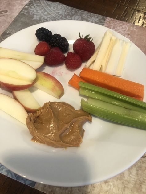 Apples, carrots, celery, some healthy peanut butter(mainly only nut not a bunch of additives) or almond butter, string cheese and a little side of berries Carrots Celery, String Cheese, Healthy Peanut Butter, Snack Time, Food Inspo, Almond Butter, Celery, Apples, Healthy Snacks