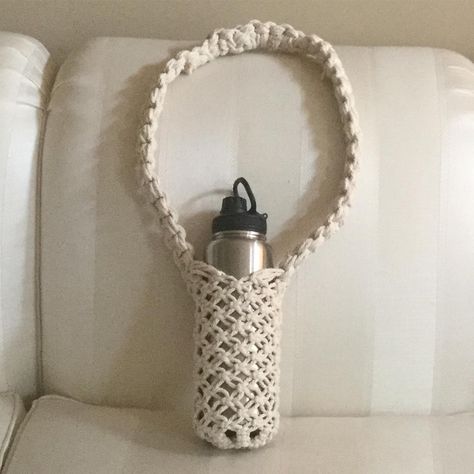 Dancing Light Mosaics on Instagram: “Bored so I made a hanging basket for my water bottle a la #modernmacramebook !  I made mine longer and also used 4 mm cotton twisted cord…” Yeti Water Bottle, Yarn Bottles, Bottle Hanger, Basket Weaving Patterns, Water Bottle Holder, Diy Macrame, Macrame Plant Hangers, Plant Hangers, Modern Macrame