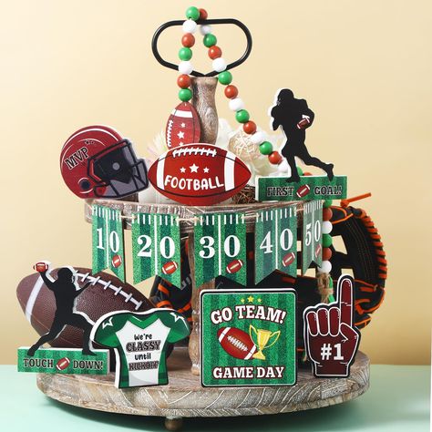 PRICES MAY VARY. Football Table Centerpiece: you will get 13 pieces football wooden tiered tray decors in different models, including wooden banner with 5 football score, 1 football wood bead garland and 7 football wooden signs; The enough quantity can meet your football party decoration Unique Design: the football wooden centerpieces adopt the design of classic football elements include rugby football, football player silhouette and meadow etc. pattern; Designed with a flat bottom, it is simple Football Table Decorations, Football Tiered Tray, Tailgate Party Decorations, Wooden Tiered Tray, Wooden Football, Football Party Decorations, Football Table, Wooden Centerpieces, Football Birthday Party