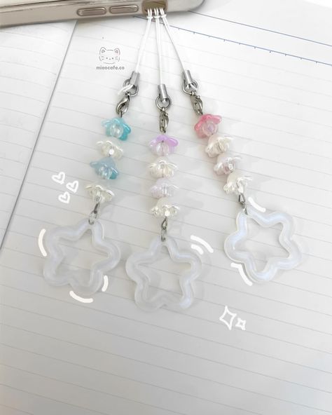 —star lily collection .☘︎ ݁˖ handmade & inspired by the lily of the valley available in 2 designs ↴ [small] lily of the valley phone charm - dark blue - blue - purple - pink [large] lily of the valley phone charm - blue - purple - pink available soon on our website! ꒰ᐢ. .ᐢ꒱₊˚⊹ #keychains #keychaincollection #smallbusiness #lilyofthevalley #cutekeychain #kpopbusiness #kpopshop #smallshop #cuteflowers #keychaindesign Star Lily, E Flowers, Kpop Shop, Keychain Design, Cute Keychain, Phone Charm, Lily Of The Valley, Small Designs, The Valley