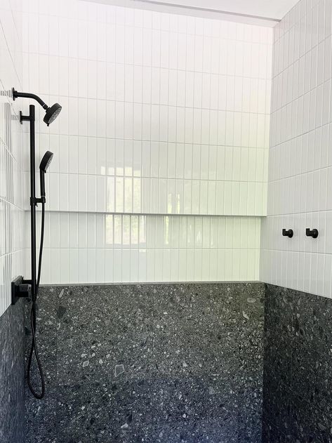 In this bathroom we worked with the customer to create a smooth floor to wall transition. We utilized the DalTile Assemble collection in a large format tile with matching grout to create a seamless look from tile to tile. We then paired a matte white subway tile on the remaining portion of the walls to help brighten the space. A wall to wall recessed niche spans the shower wall to create adequate storage but an hidden look by blending in with the tile. Matte White Subway Tile, Large Format Tile Shower Wall, Recessed Niche, Tile Transition, Master Bath Renovation, Bathtub Tile, Industrial Bathroom, Large Tile, Large Format Tile