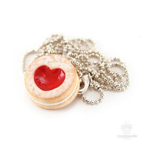 Size: 18 inch silver plated ballchain, heart cookie is 5/8" wideMaterial: Polymer clay, gloss, silver plated findingsSmells like: Strawberry shortcake cookies Is food the language of love? If so, this adorable Scented Shortcake Heart Cookie Necklace speaks volumes! Forget the symbolism of a single red rose, this tiny cookie charm expresses romantic intention perfectly. Sweetened with a generous dusting of icing sugar, the sweet jam-filled center has been sculpted to form a beautiful heart – idea Shortcake Cookies, Strawberry Shortcake Cookies, Single Red Rose, Heart Cookie, Delicious Clean Eating, Heart Shaped Cookies, Heart Cookies, Tiny Hand, Savoury Cake