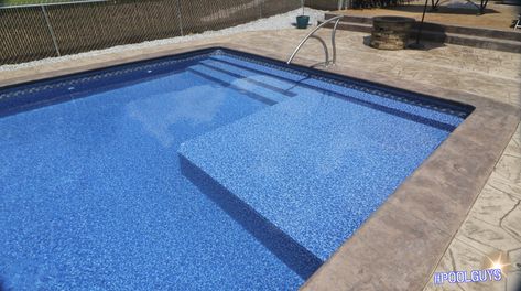 This Radiant Pool showcases a customized build; Tanning ledge with 3 steps. Concrete trim: bullnose and light Entry rail Liner Pools Inground With Tanning Ledge, Modern Pool Ideas, Modern Pool Deck, Radiant Pool, Modern Swimming Pool Designs, Pool Steps Inground, Modern Outdoor Living Area, Pool Concrete, Modern Swimming Pool