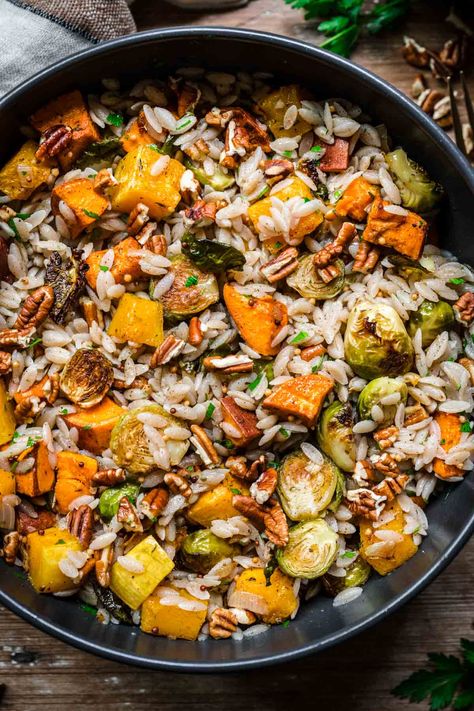 This Orzo Harvest Salad takes one of our favorite grains and pairs it with fall flavors like roasted squash, brussels sprouts, and pecans. Tossed with a maple mustard dressing, this salad has sweetness, crunch, richness, and a bit of zip. Perfect for an autumn dinner or lunch (and it's 100% vegan!). Sweet Potato Orzo Salad, Brussel Sprout Orzo Recipes, Autumn Orzo Salad, Thanksgiving Orzo Salad, Orzo Brussel Sprout Salad, Fall Orzo Recipes, Fall Orzo Salad, Roasted Veggie Orzo Salad, Pumpkin Orzo