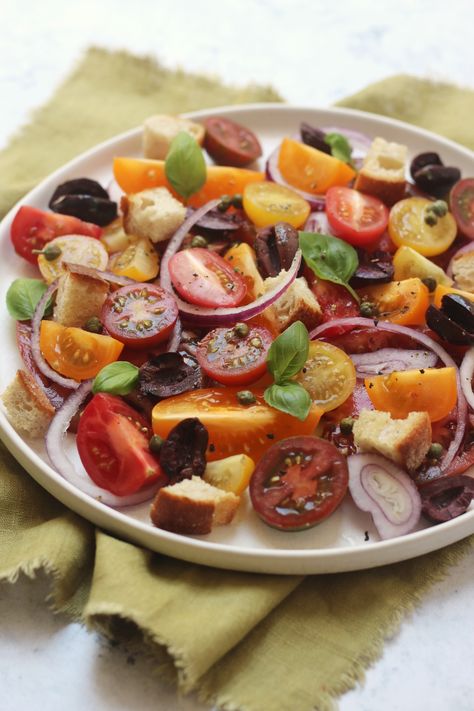 A vibrant plate of heritage tomatoes, capers, kalamata olives, red onion and basil leaves (Panzanella Salad) Roast Tomato Salad, Tomato Salad Aesthetic, Bread Tomato Salad, Fennel Tomato Salad, Sesame Tomato Salad Nyt, Veg Trug, Heritage Tomatoes, Panzanella Salad, Italian Salad