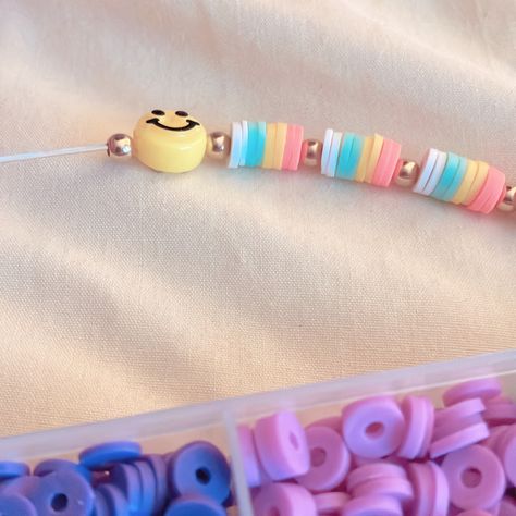 Making a bracelet! It will be for sale on etsy soon! Clay Bead Bracelet With Smiley Face, Smile Clay Bead Bracelet, Cheap Cute Smiley Face Beaded Bracelets, Cheerful Beaded Bracelets With Smiley Face, Making A Bracelet, Playful Multicolor Smiley Face Beaded Bracelets, Pulseras Kandi, Bracelet Stuff, Clay Bracelets