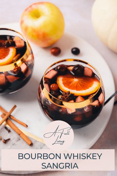 This Low Carb Fall Harvest Bourbon Whiskey Sangria is a fall treat. It combines apple cinnamon infused whiskey with red wine, apple cider and homemade sugar free keto grenadine with plenty of amazing fruit and warm fall spices to create a stunning drink! This fall harvest sangria is easy to please a crowd and whip up ahead of time for holiday festivities. #afullliving #WhiskeySangria #FallCocktails #sangriarecipes #fallsangria Sangria With Bourbon Recipes, Fall Sangria Recipes Bourbon, Whiskey Sangria Recipes, Fall Sangria With Bourbon, Cinnamon Whiskey Sangria, Whiskey Sangria, Bourbon Sangria, Harvest Sangria, Infused Whiskey