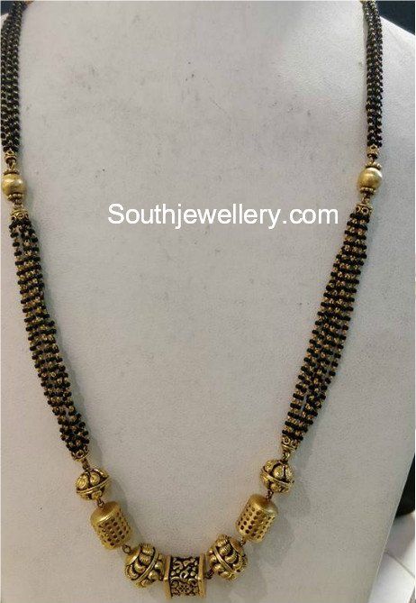 Long Black Beads Chain photo Mangalsutra Chain, Black Beads Mangalsutra, Black Beads Mangalsutra Design, Antique Gold Jewelry Indian, Gold Mangalsutra Designs, Gold Necklace Indian Bridal Jewelry, Beaded Necklace Designs, Gold Jewelry Stores, Black Beaded Jewelry