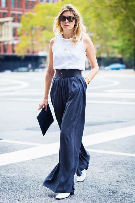 You can wear a tank top to work, as long as you pair with a polished pair of leg-lengthening pants