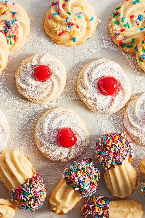 If you’ve ever been to an Italian bakery, you’ve probably seen Italian butter cookies. They come in various shapes—swirls or cat’s tongues—and everyone has their favorite. All of the variations start with the same base dough: intensely buttery, warm from a generous splash of vanilla, and tender from a combination of powdered and granulated sugars. Then you can choose your own adventure with the toppings and flavors. Here's how to make homemade Italian butter cookies. Italian Whipped Butter Cookies, Bon Appetit Cookies, Italian Butter Cookies Recipe, Butter Cookies With Powdered Sugar, Italian Cookies Authentic, Bread Decoration, Sprinkle Cookies Recipe, Italian Butter, Italian Butter Cookies