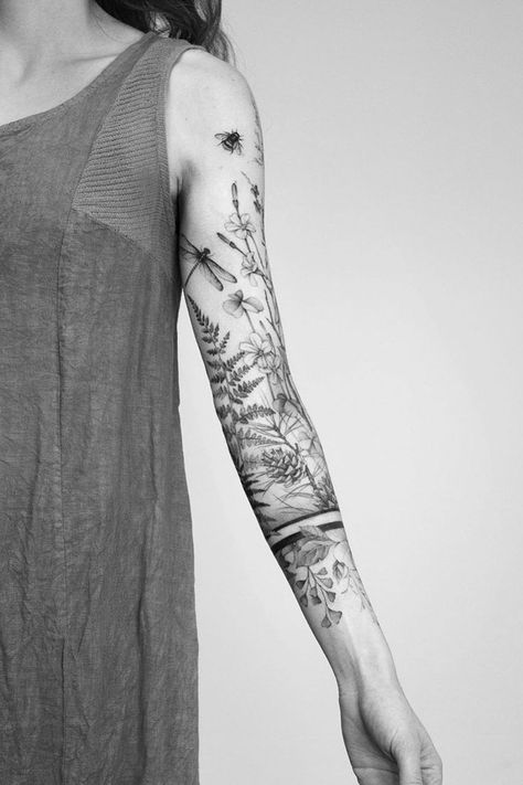 Sleeve tattoos are a popular choice for women who want to stand out from the crowd due to their unique artwork. They range from small, dainty designs to full designs, from the arm to the wrist, and there are many variations to make the ink unique. For those looking to honor their faith, they may be drawn to symbols like a cross or an angel, while those who wish to show traits like loyalty can choose a wolf. filler tattoo ideas for sleeves gap filler tattoo filler ideas ideas for half sleeve Sleeve Filler Ideas, Tattoo Sleeve Filler Ideas, Feminine Horror, Sleeve Filler, Tattoo Sleeve Filler, Cream Tattoo, 50 Tattoo, Arm Sleeve Tattoos For Women, Tattoo Filler