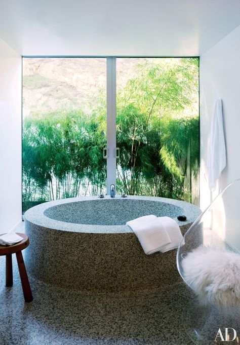 Ronnie Sassoon designed the terrazzo tub in the master bath of the Bel Air home she shared with her husband, the late Vidal Sassoon. See more luxurious celebrity bathrooms now. Celebrity Bathrooms, Round Bathtub, Luxury Bathtub, Richard Neutra, Vidal Sassoon, Beverly Hills Houses, Bathtub Design, Your Favorite, Celebrity Houses