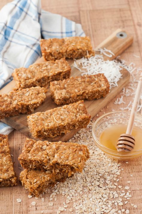 honey coconut oat granola bar recipe. It's the perfect time to try making your own granola bars #healthy #recipes #healthyrecipes #snackrecipes #snacks #veganrecipes Bobos Oat Bars Copycat Recipe, Honey Oat Slice, Oat Slice Healthy, Trail Bars, Muesli Bar Recipe, Cranberries Dried, Bars Recipes Healthy, Homemade Granola Bars Healthy, Oat Slice